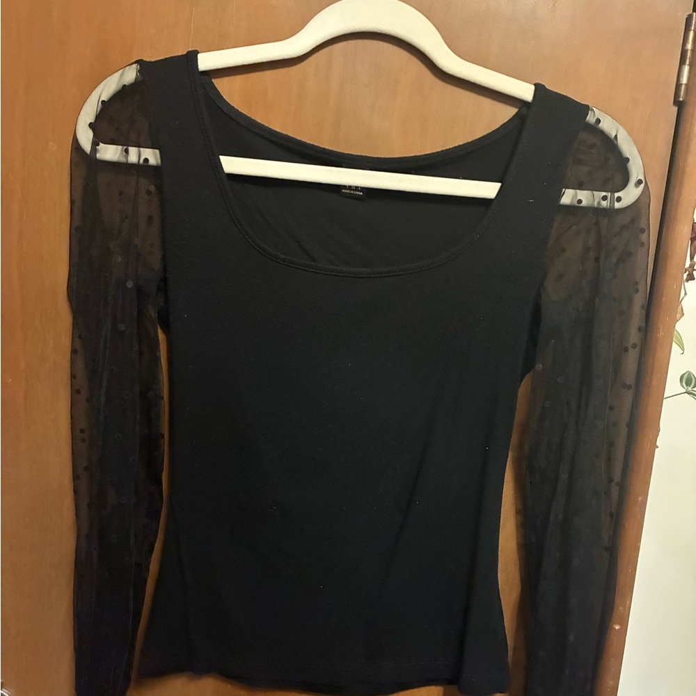 Black shirt with sheer polkadot long sleeves and solid black cuffs